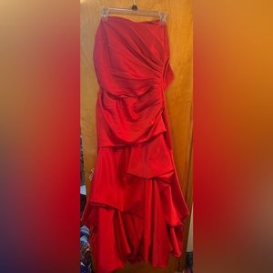 Red strapless fluffy prom dress.